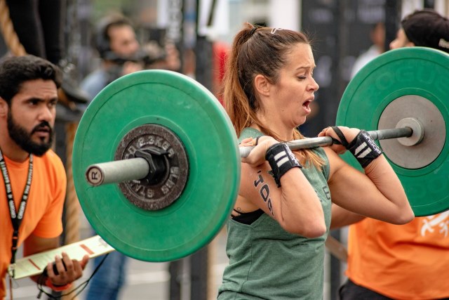 a woman is lifting a barbell | post cycle therapy of performance enhancing